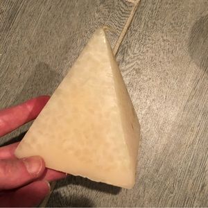 Tan pyramid shaped candle